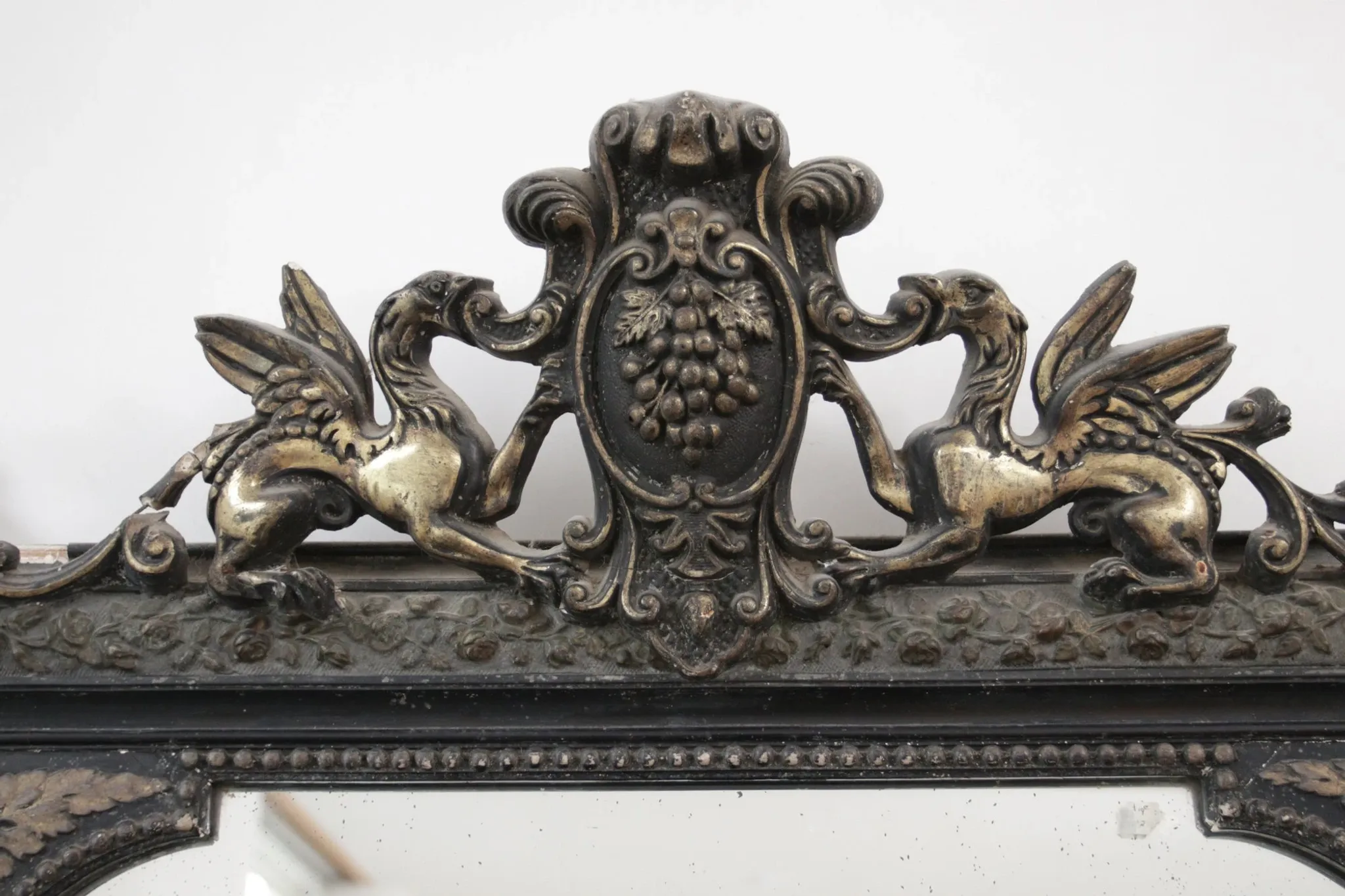Antique 19th-century mirror with griffins and console table