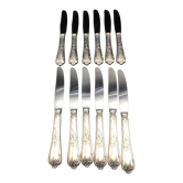 12 silver metal table knives model Rocaille