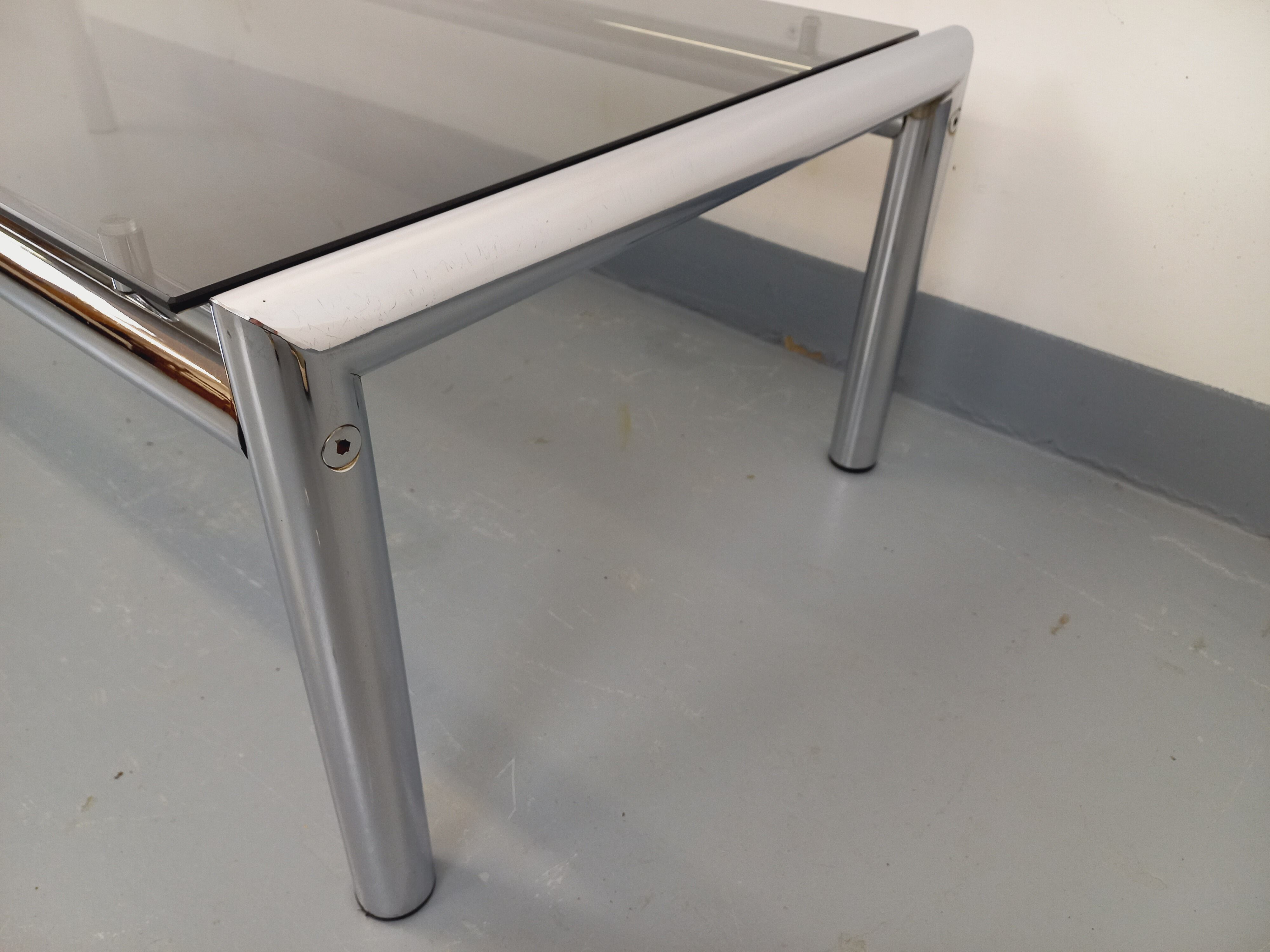 Vintage rectangular coffee table in smoked glass and chrome metal from the 1960s.