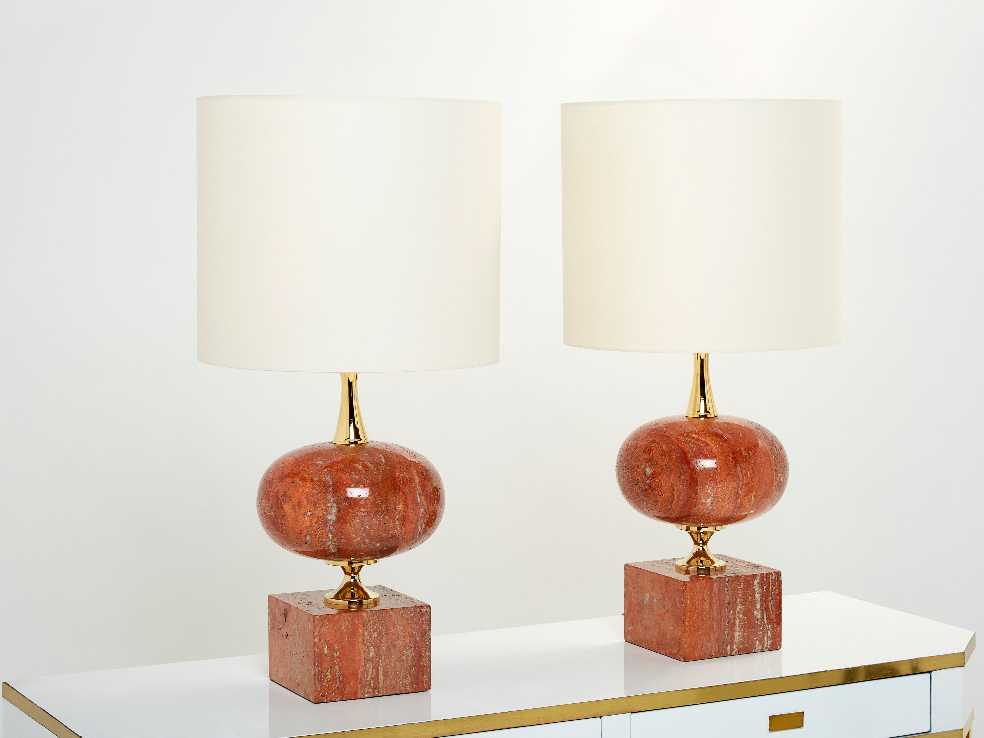 Pair of lamps in red travertine and brass 1970
