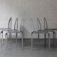 Set of 6 dining chairs in bent aluminum, 1980’s