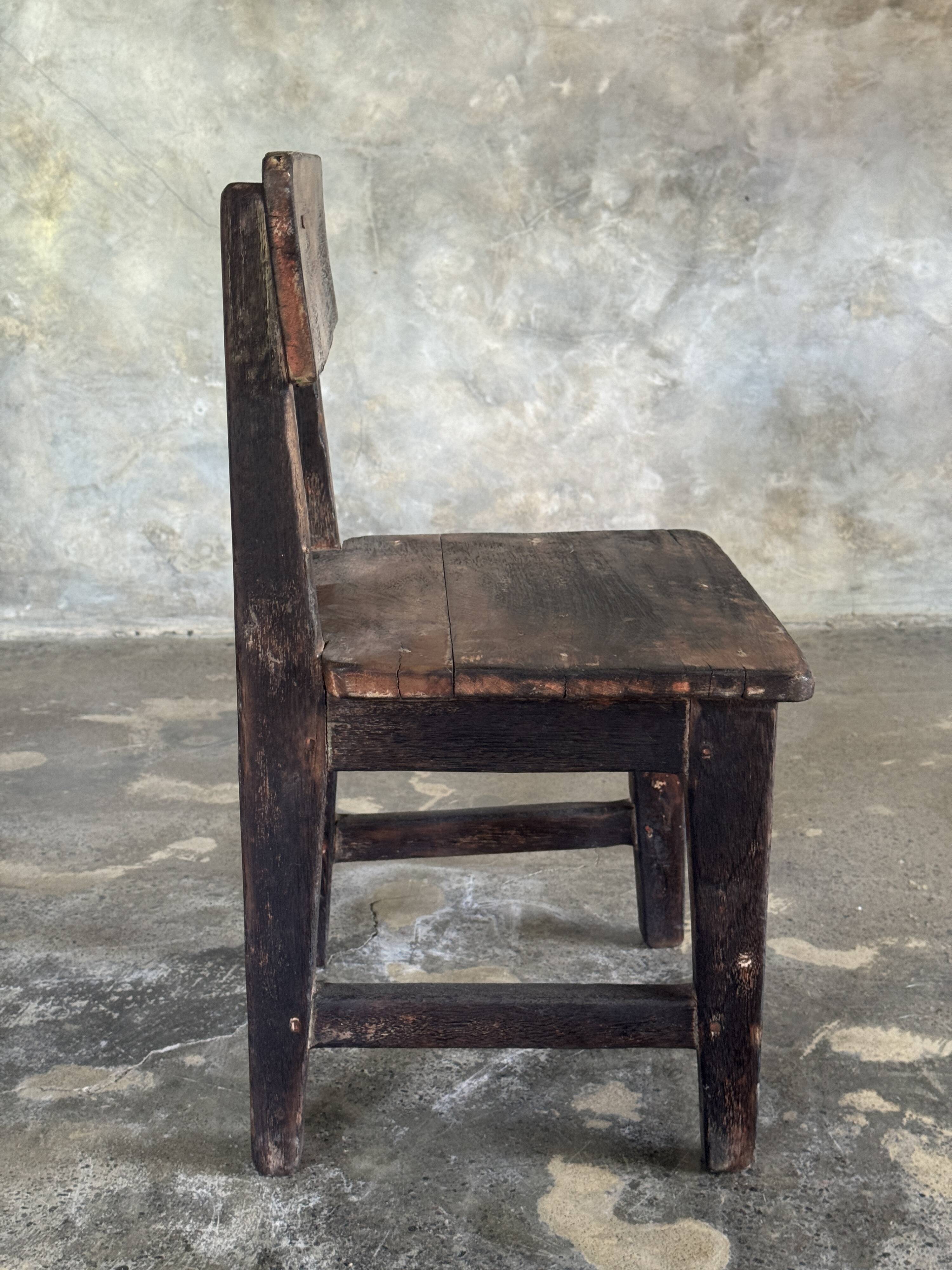 Small antique Indonesian children's chair in teak.