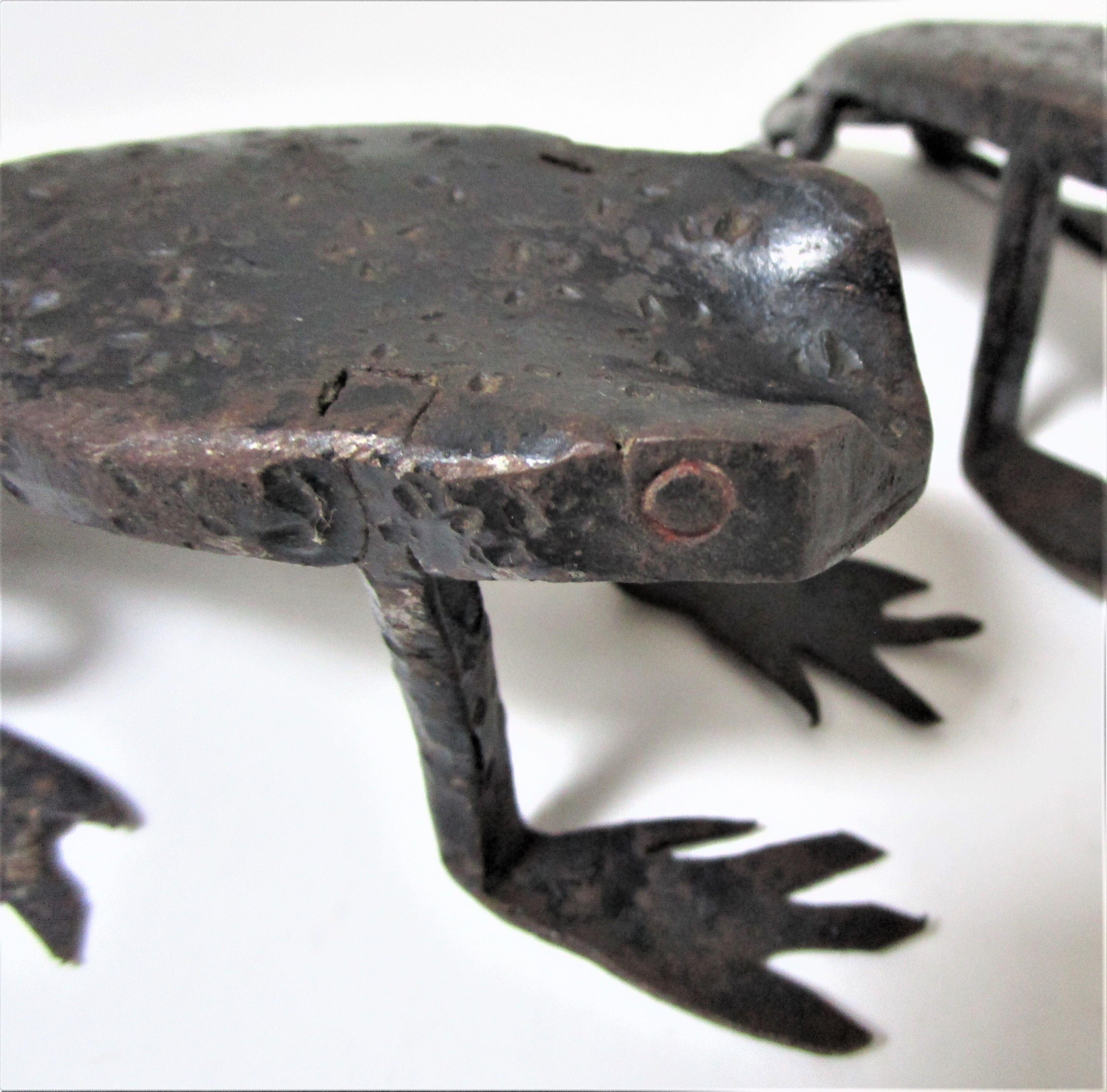 Two metal clipboard frogs patinated vintage brutalist