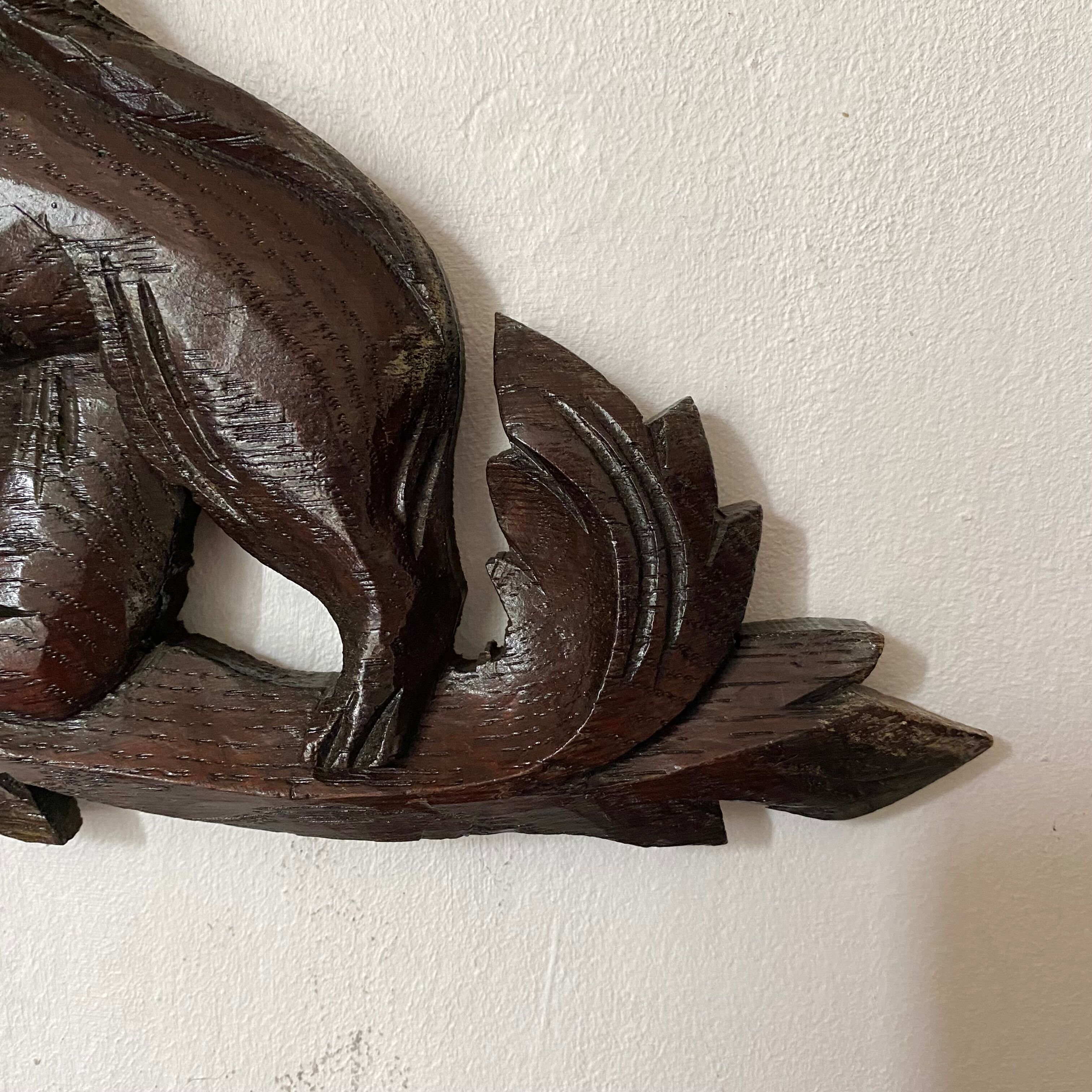 Antique carved wooden pediment with lions and medallion