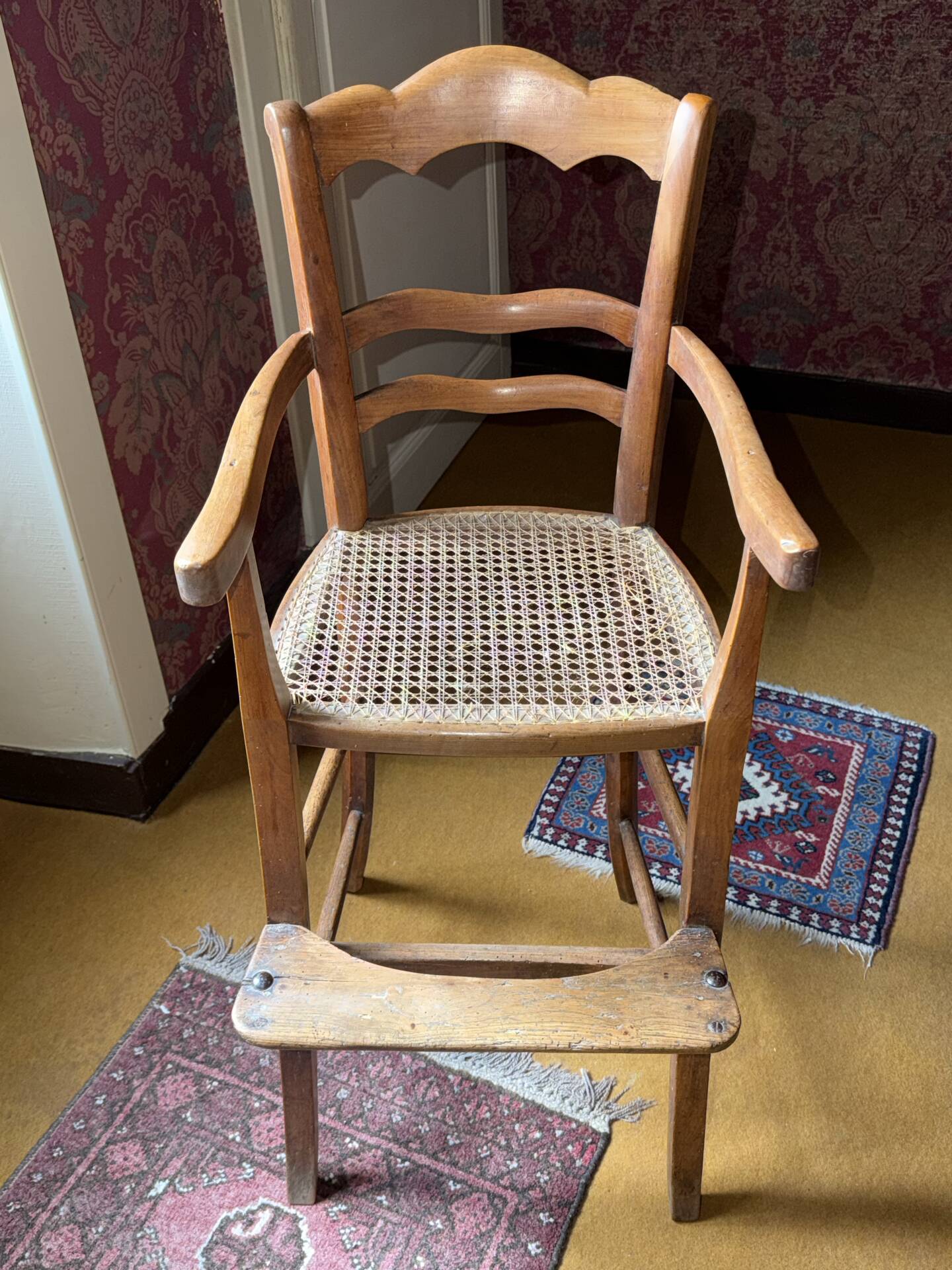 Old wooden children's chair – caned seat – rustic furniture