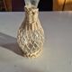 vintage glass vase surrounded by woven rattan
