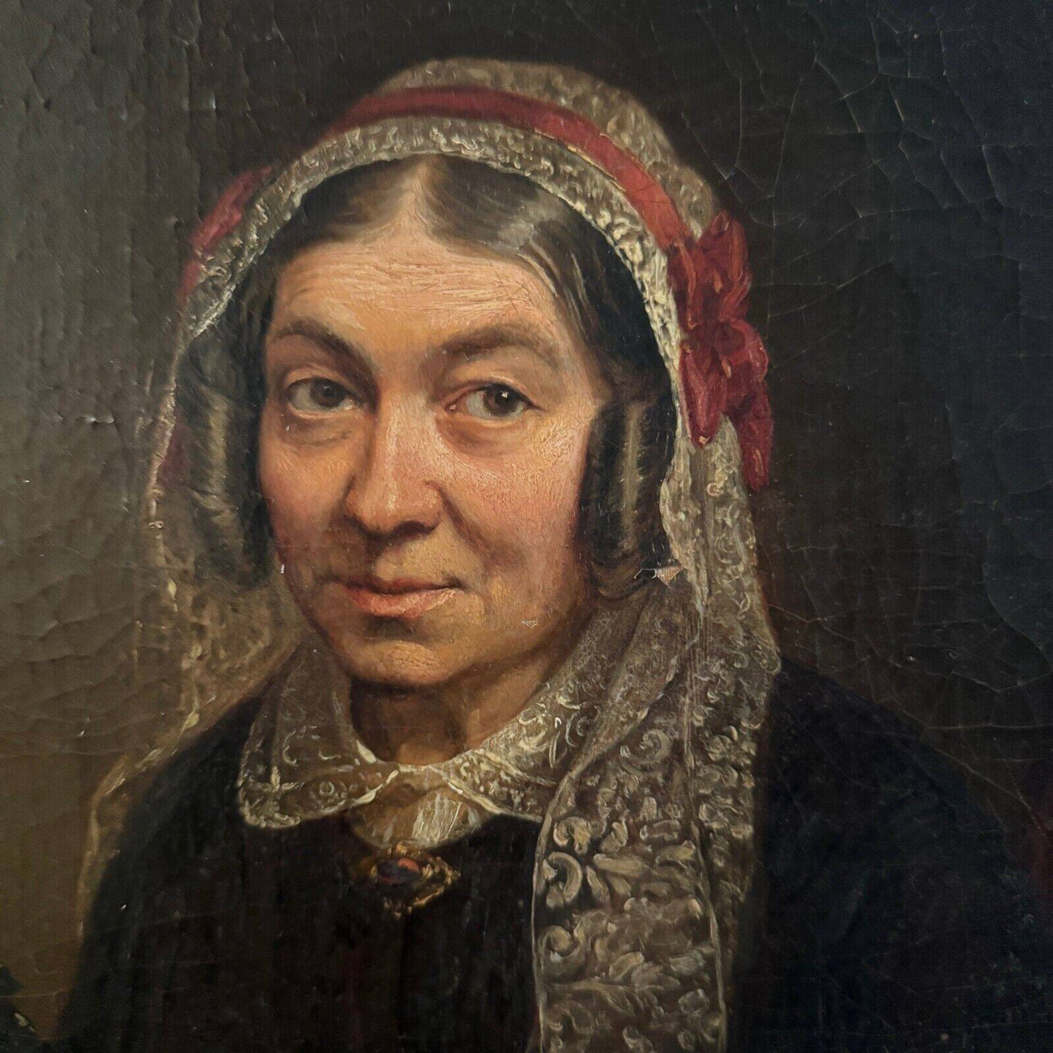 Late 19th century portrait representing a woman with a headdress and lace