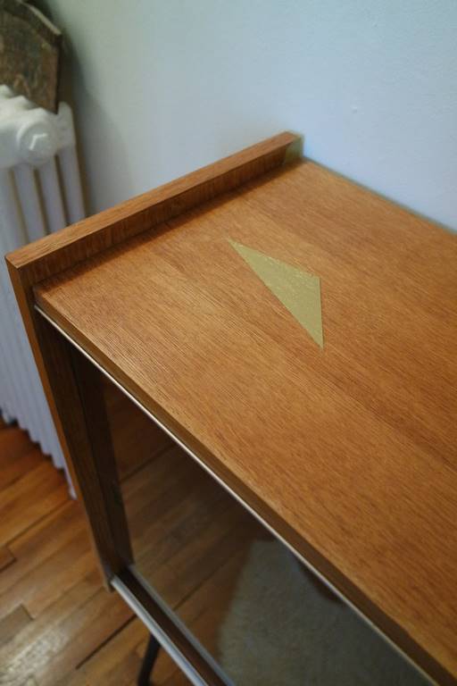 Small window on high metal feet