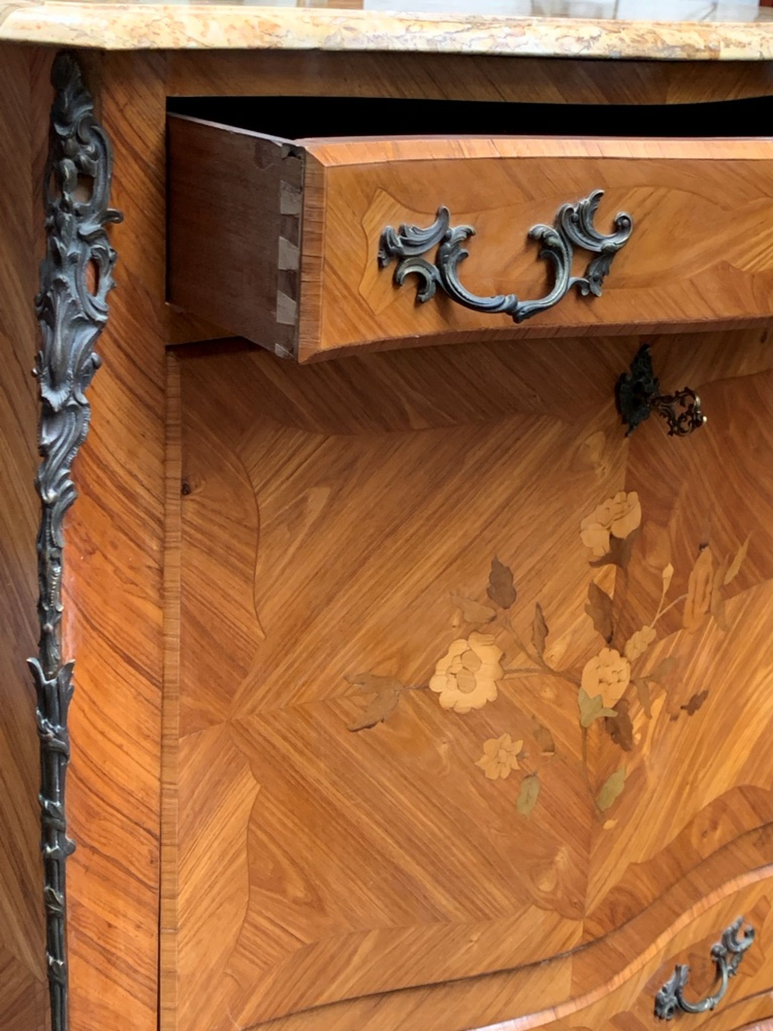 Old French secretary in bronze and wood marquetry.