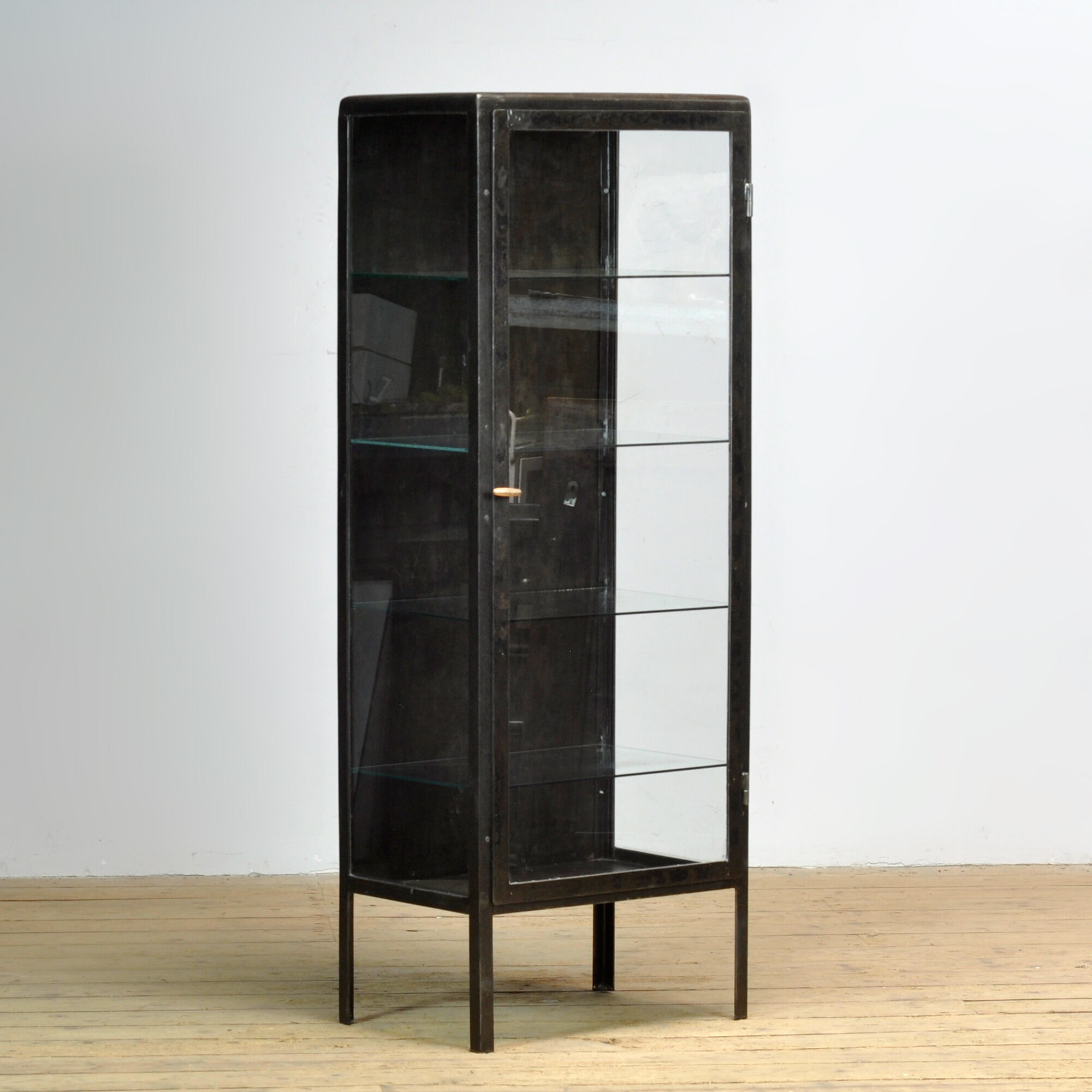Polished iron medicine cabinet, 1920s