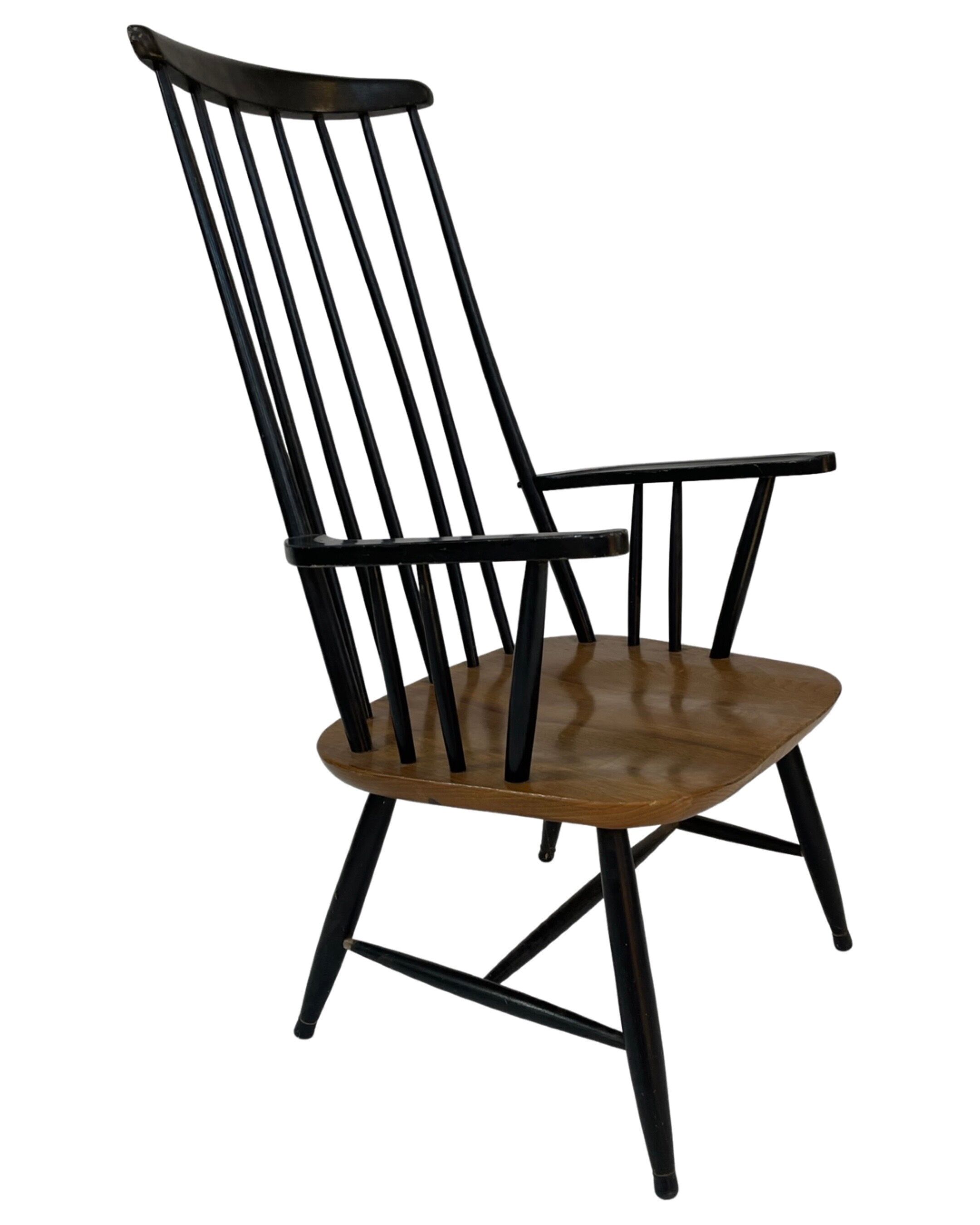 Vintage easy chair with high back and armrest from the 60s