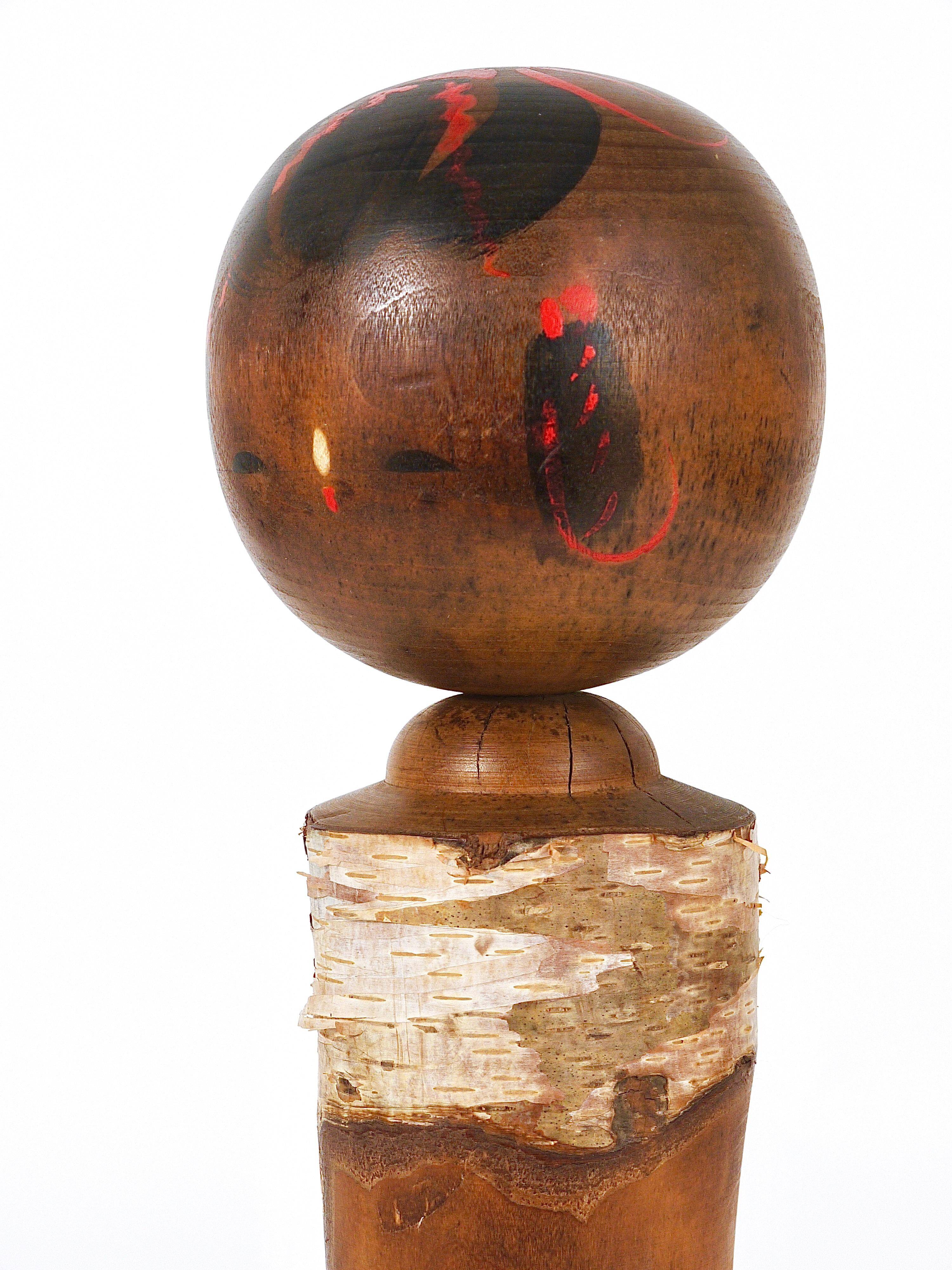 Decorative Kokeshi doll sculpture from northern Japan, hand-painted.