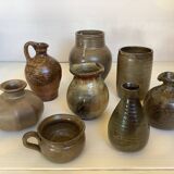 Eight brown ceramic pitcher vases