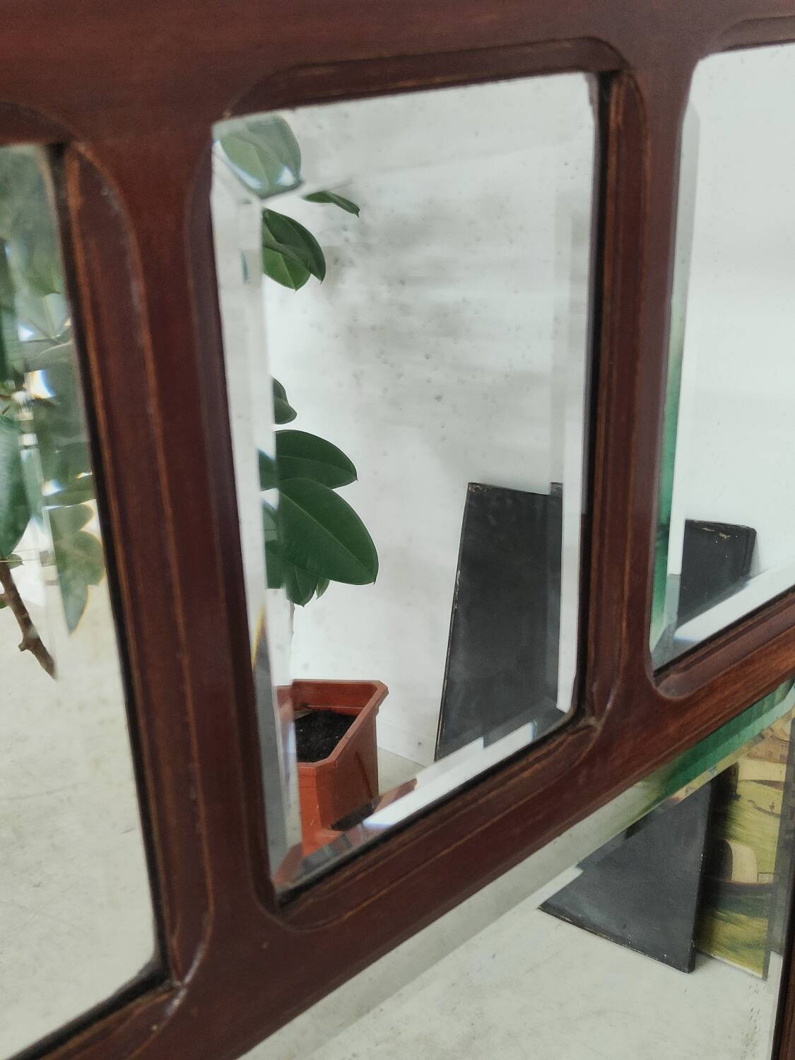 Antique beveled mirror on a wooden frame, 1930