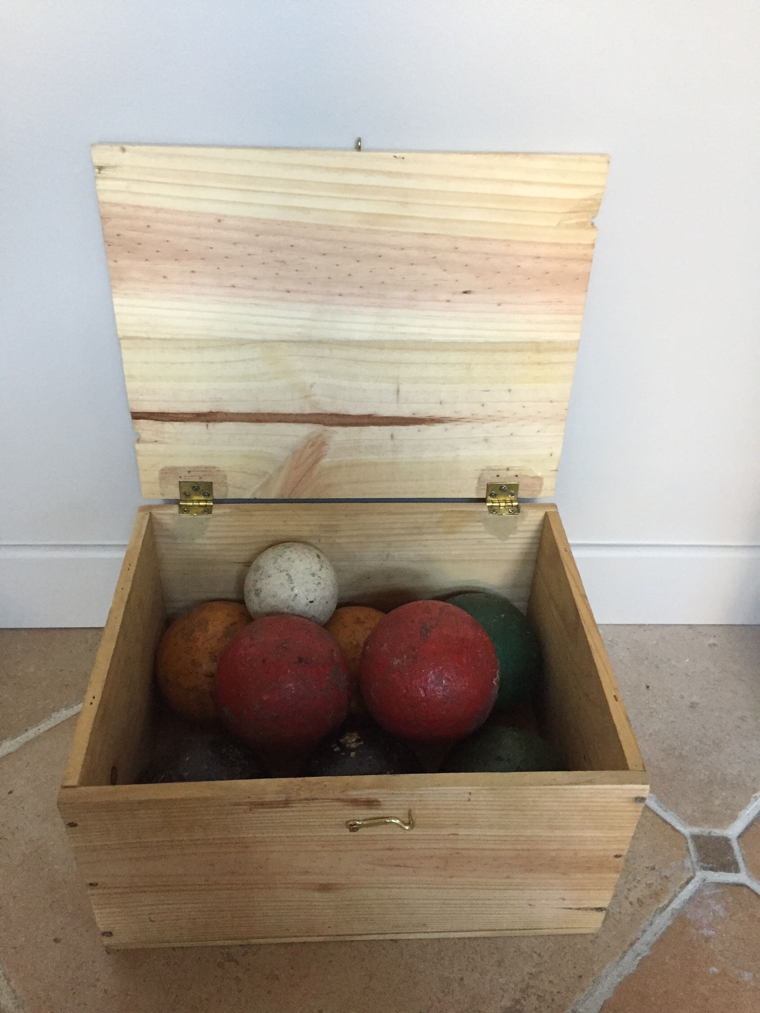 Very old game of wooden petanque balls with piglet
