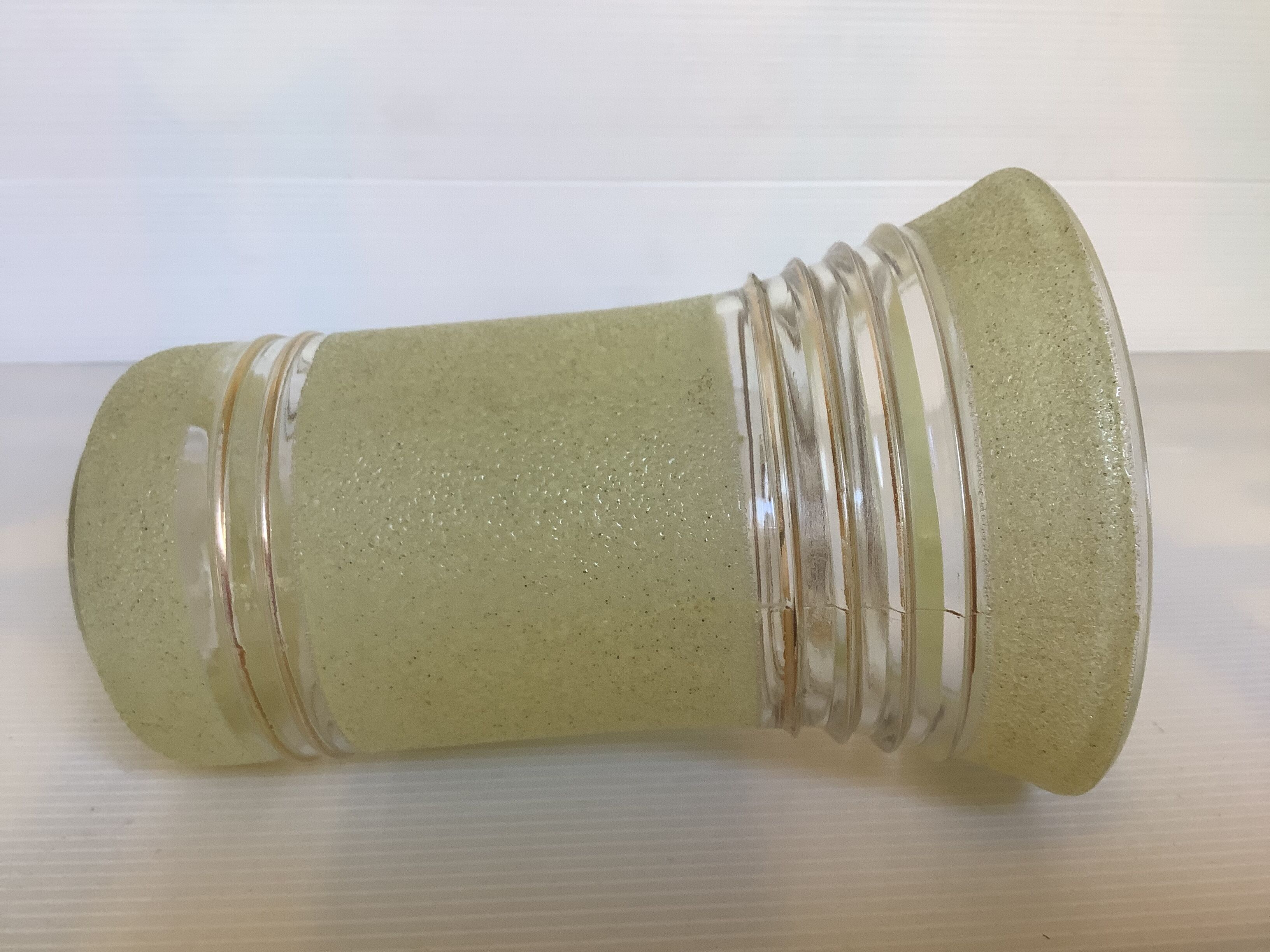 Old yellow frosted glass vase