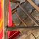 Vintage deck chair with red and orange striped fabric, original patina.