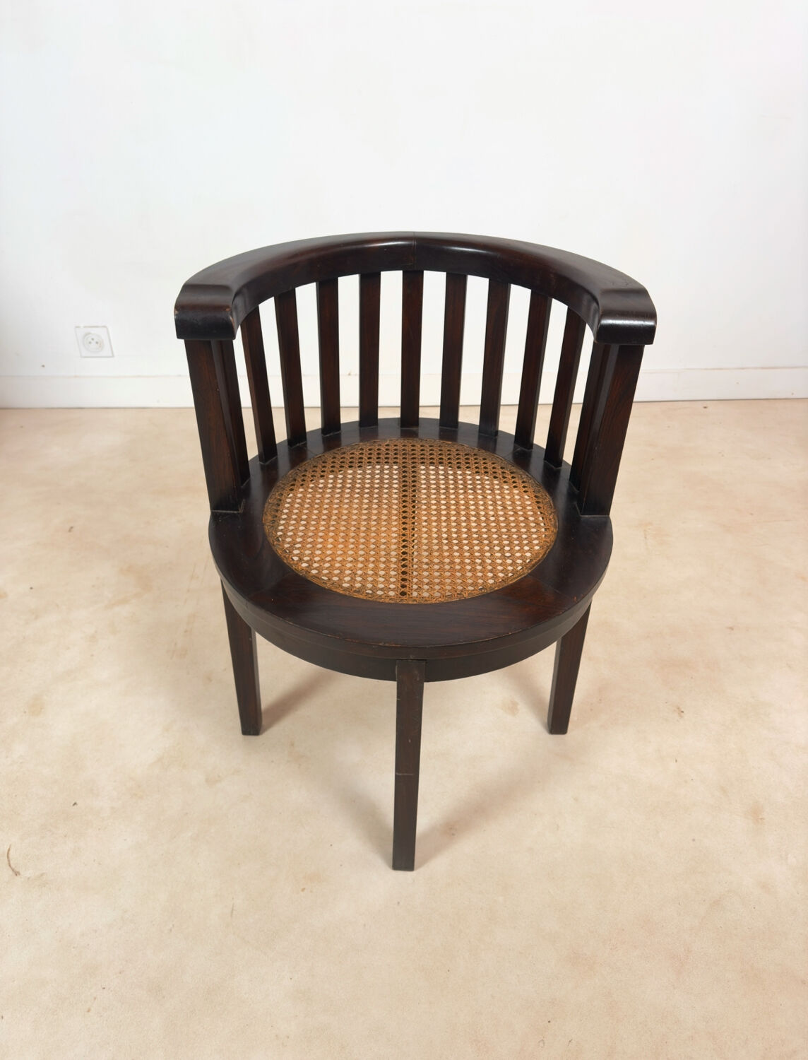 Colonial "Art Deco" armchair in wood and cane.