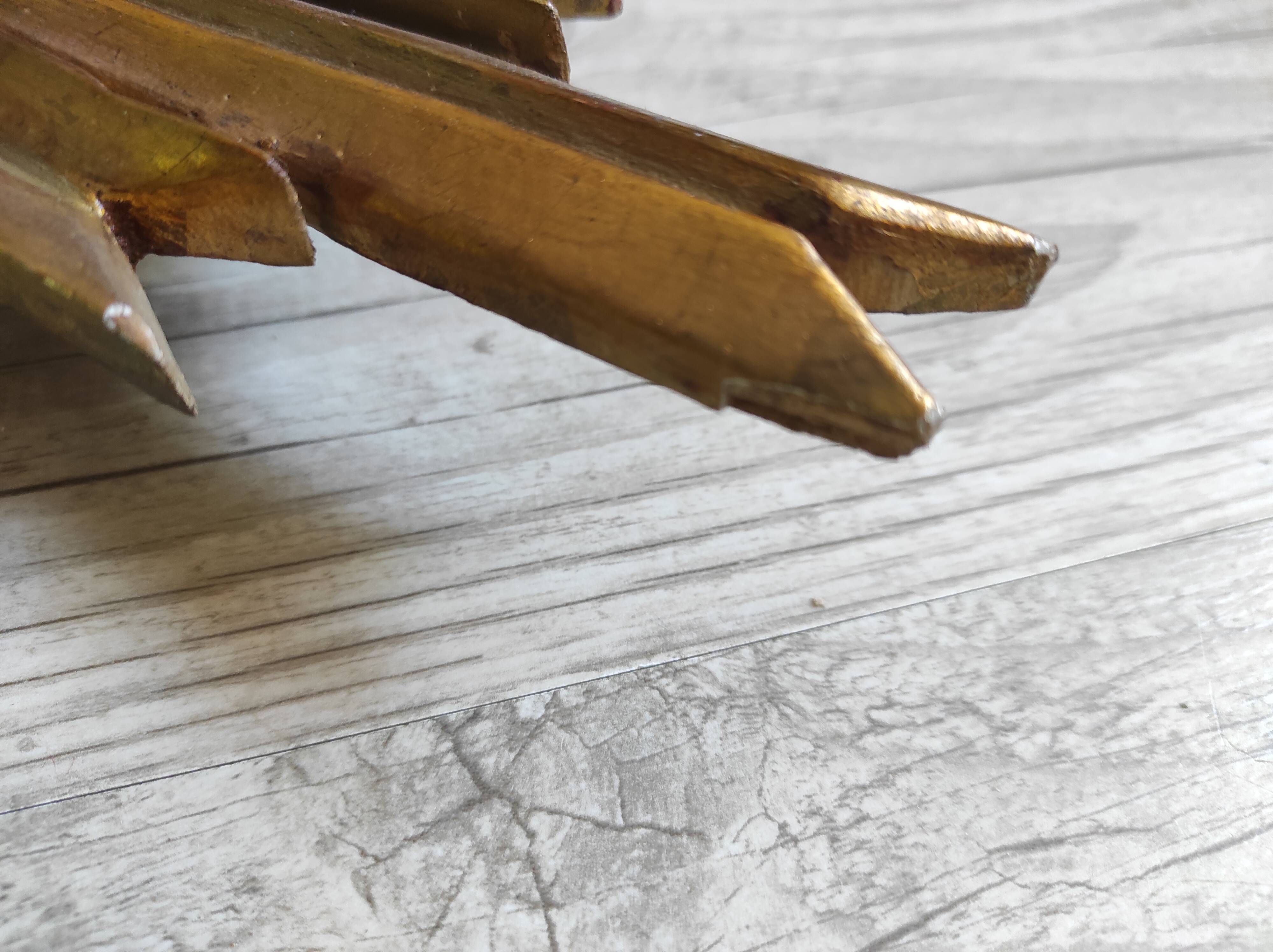 Sun mirror and witch's eye in gilded wood