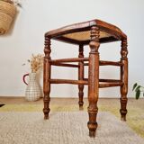 Wooden stool with cane seat