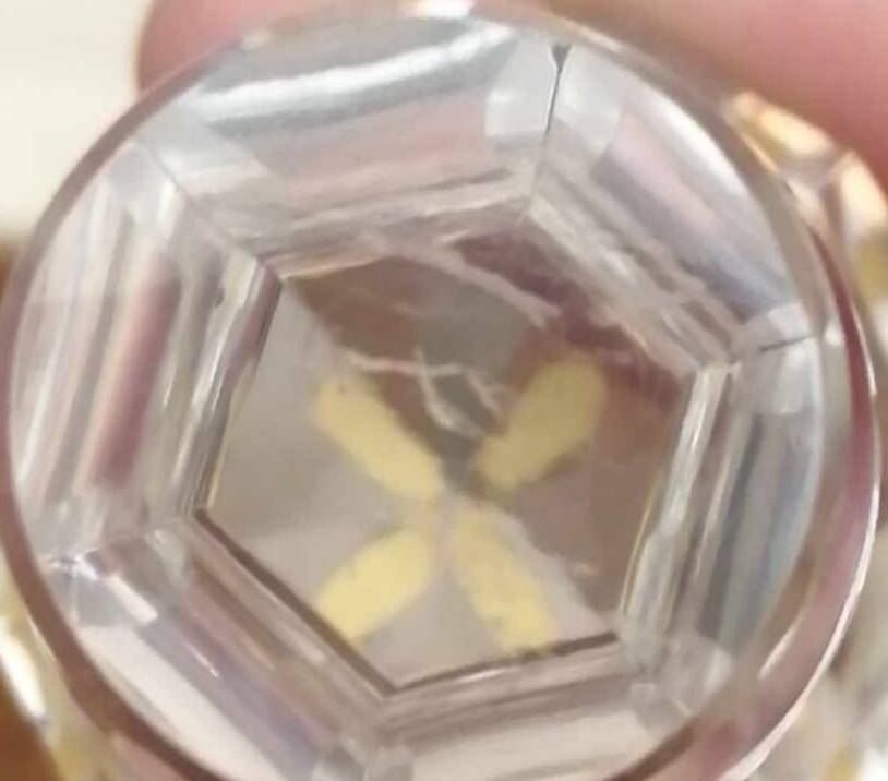 Old crystal decanter with gold decoration