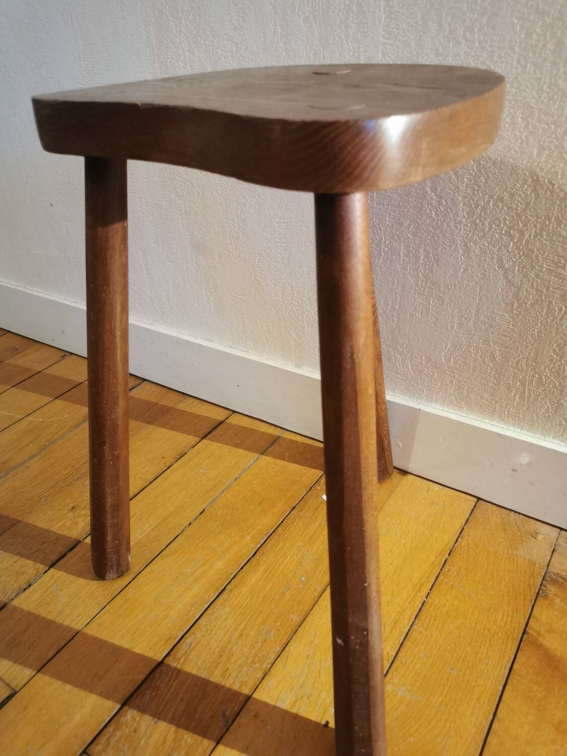 Old wooden tripod bench stool milking shepherd’s bench