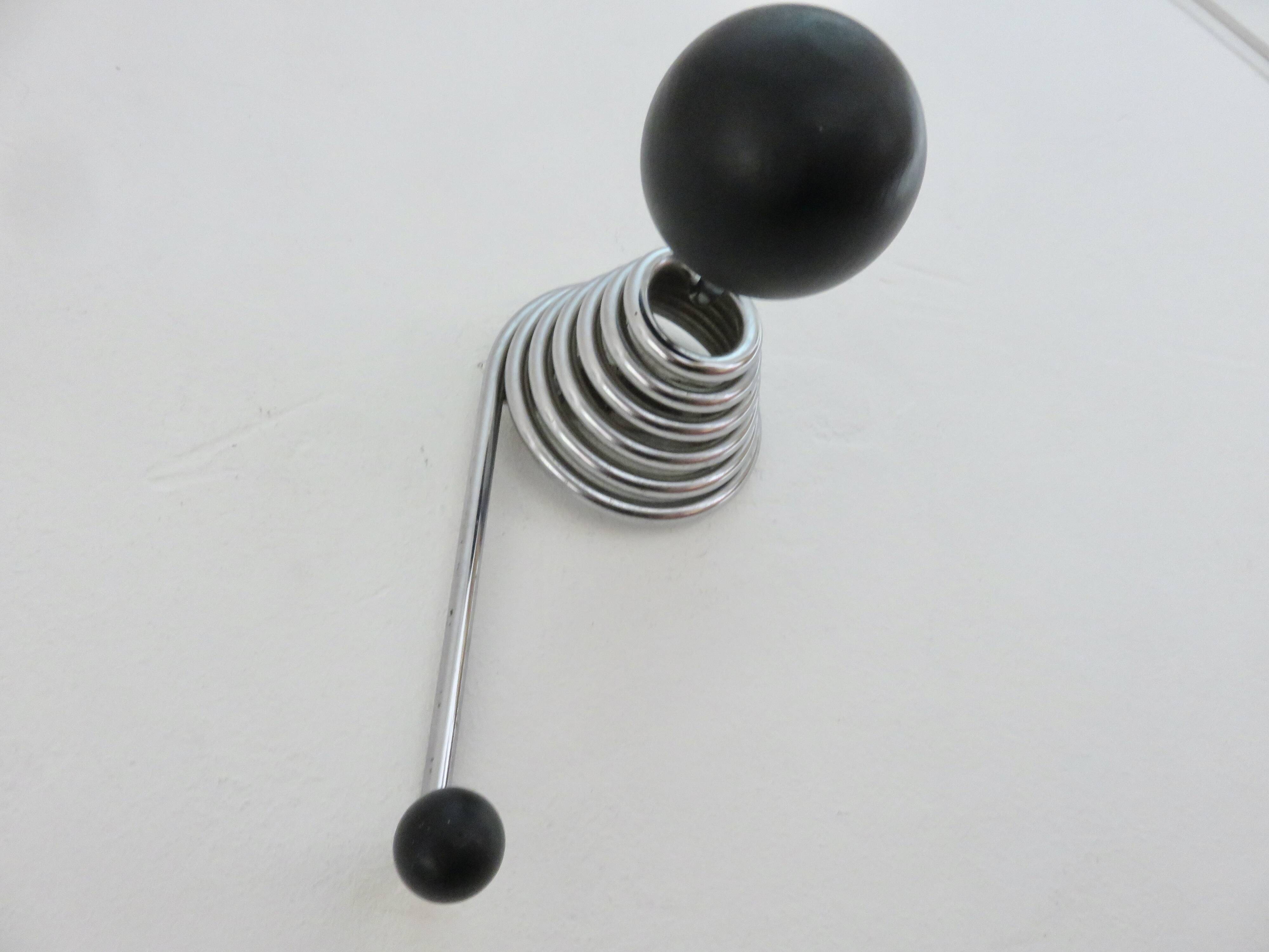 "Streamline" wall coat rack in chromed metal and black lacquered wood, 1970.