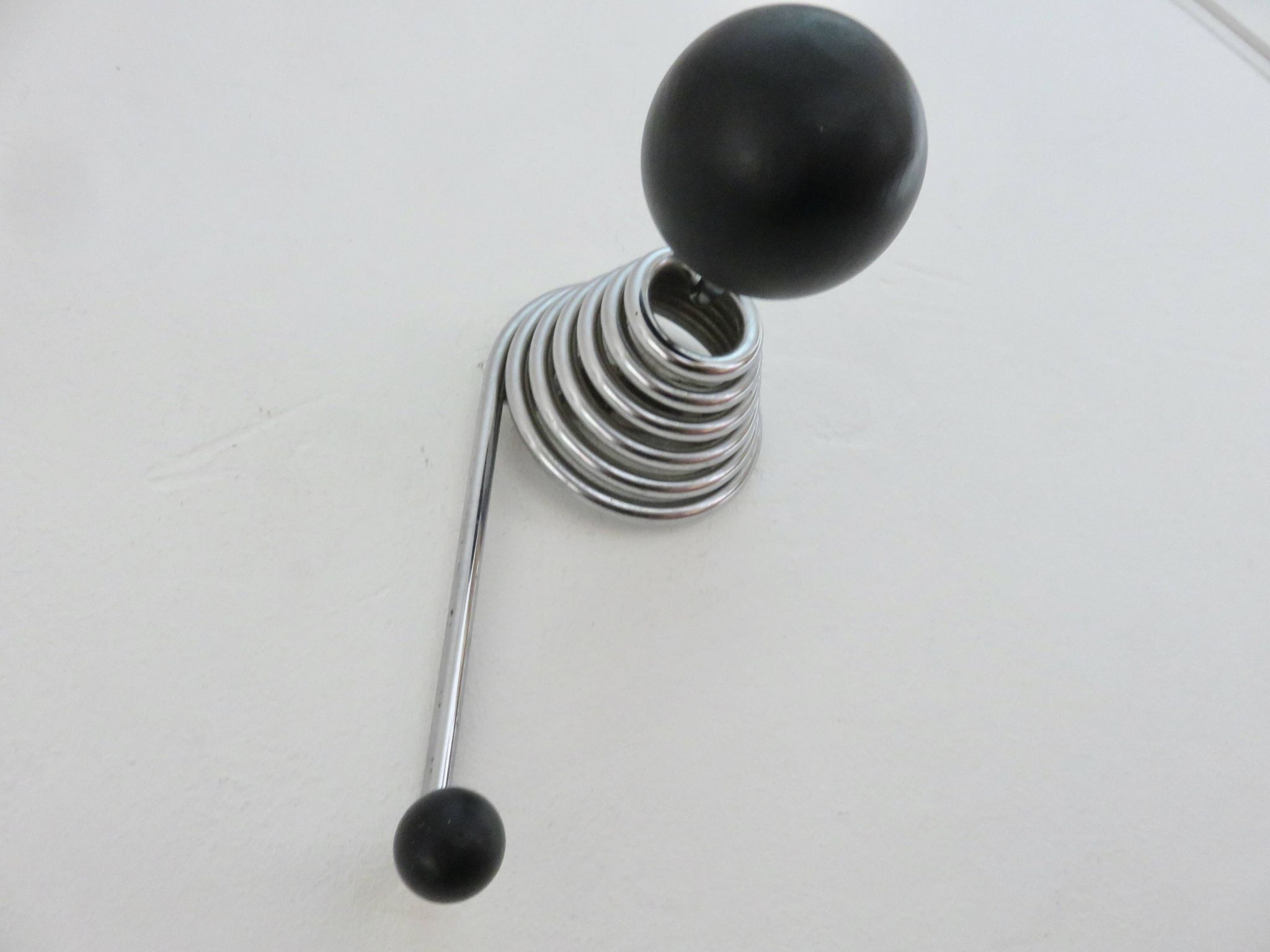 "Streamline" wall coat rack in chromed metal and black lacquered wood, 1970.