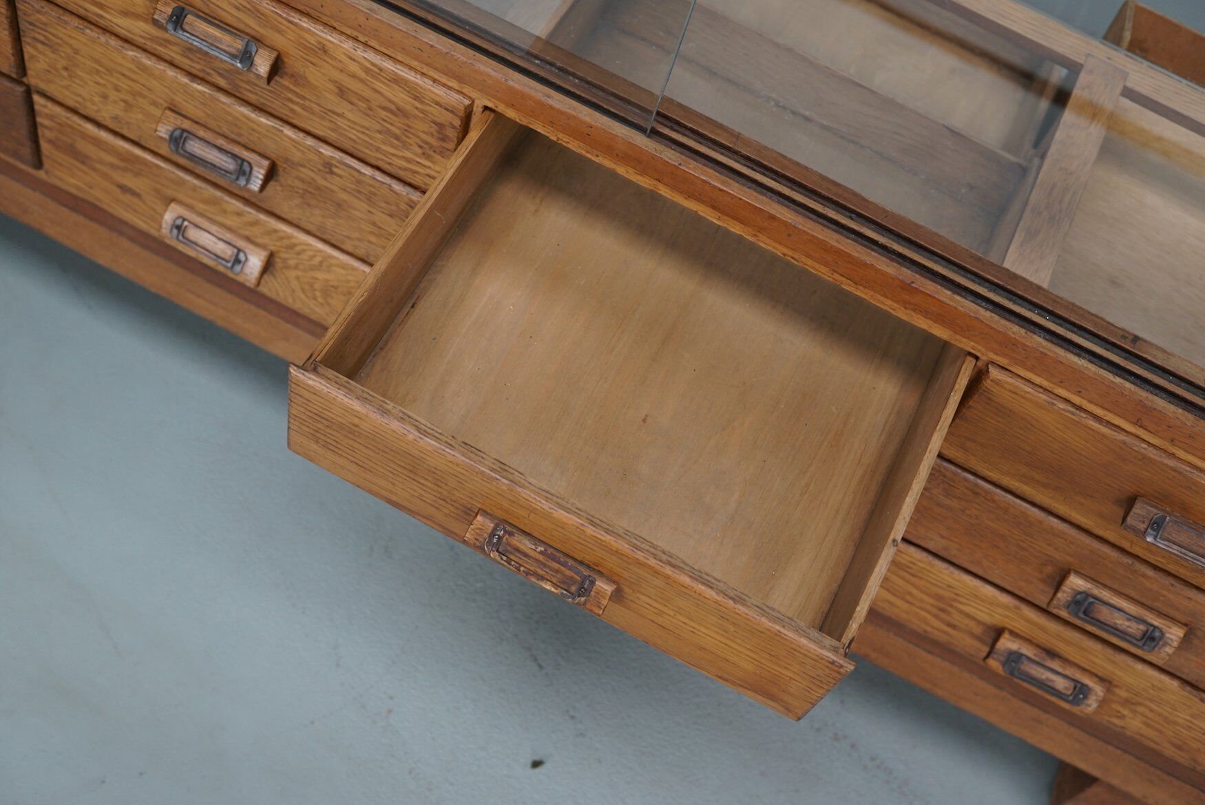 Antique British oak haberdashery cabinet, 1930s