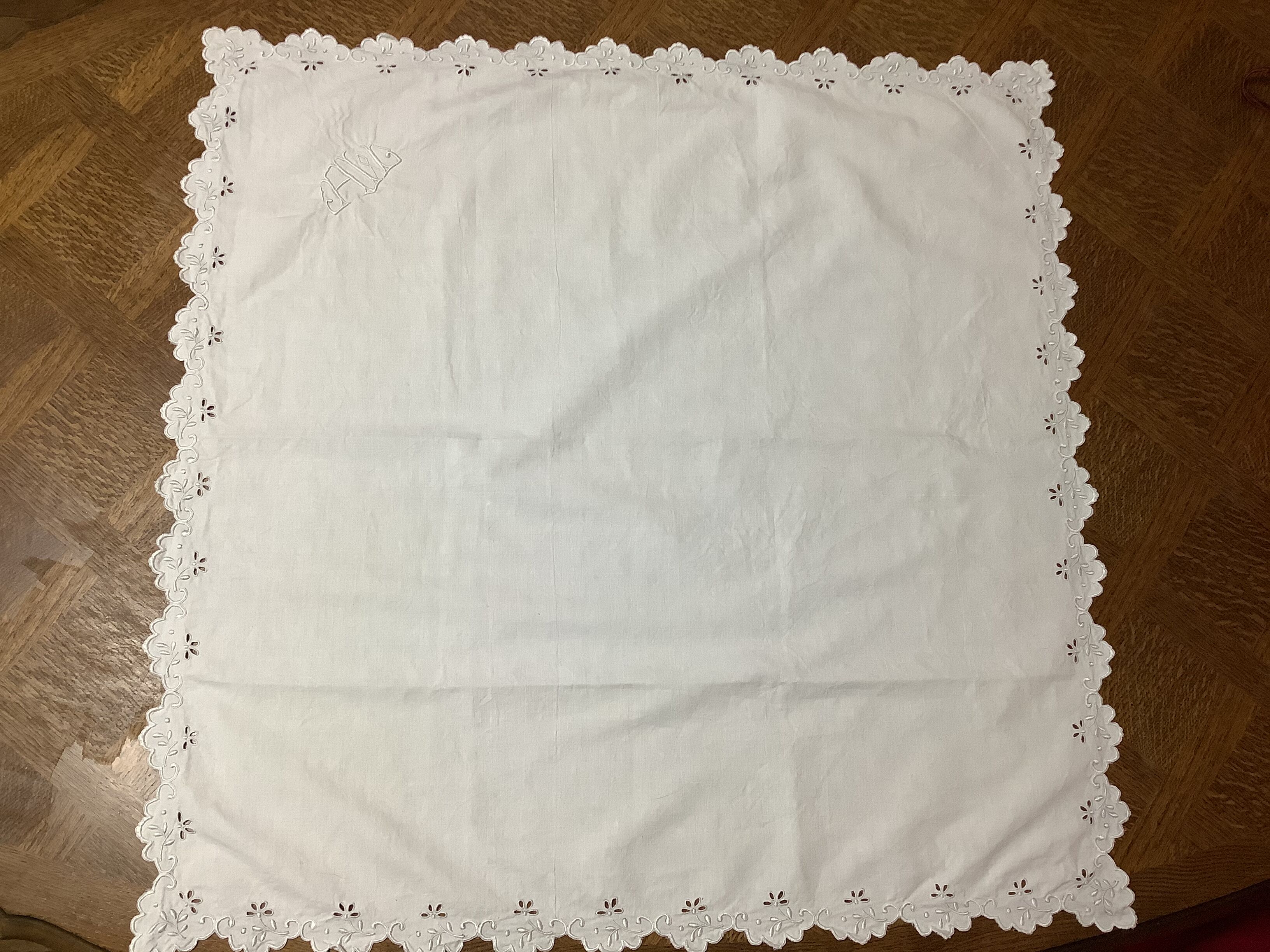 Embroidered table placemat with initials AW