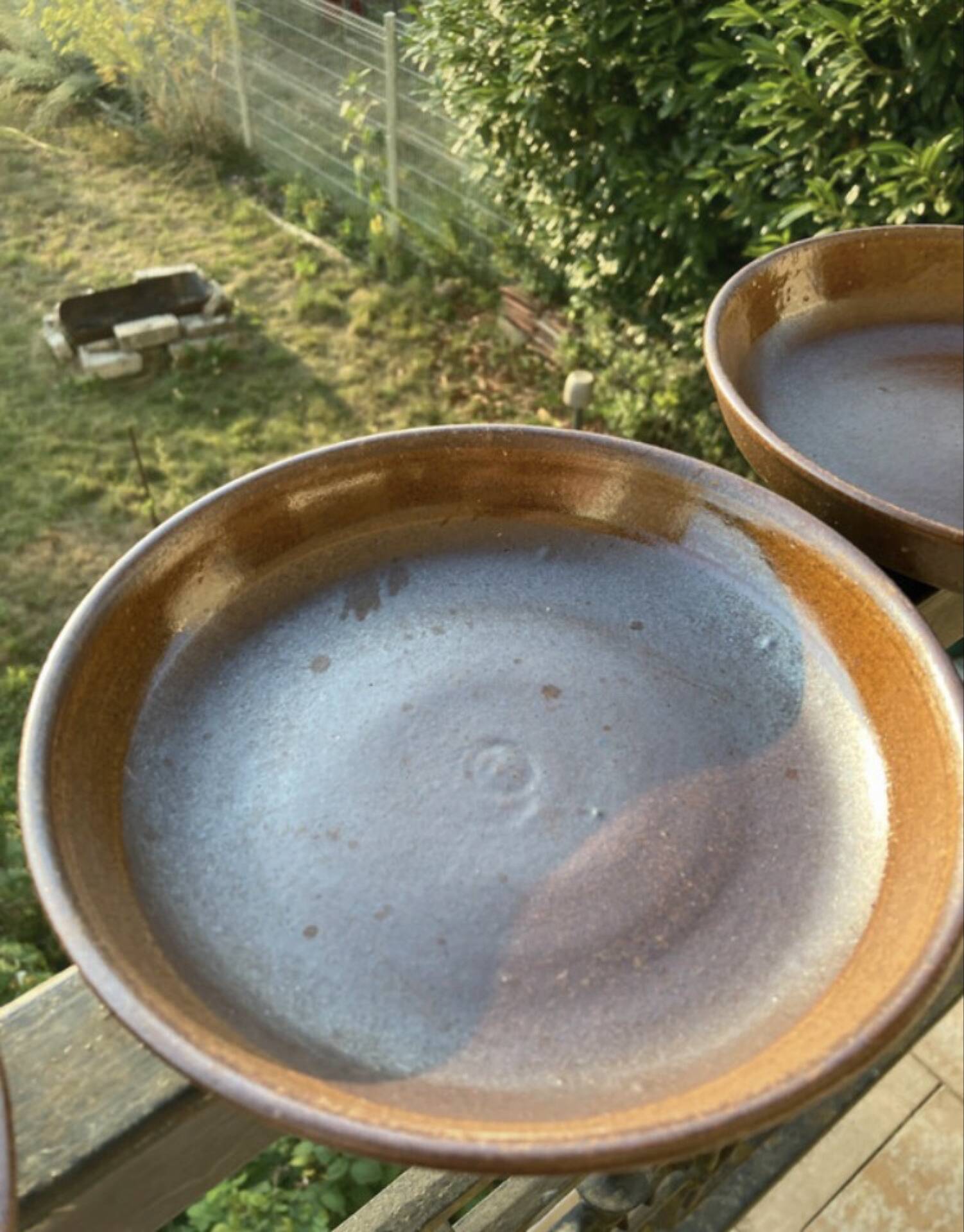 Deep plates made of organic, wild, earthy marsh clay.