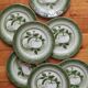 7 earthenware dessert plates with apple decoration and slip-brushed rim, KG Lunéville