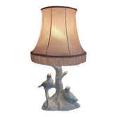 Ceramic lamp with birds, pink fringed shade, 1950s.