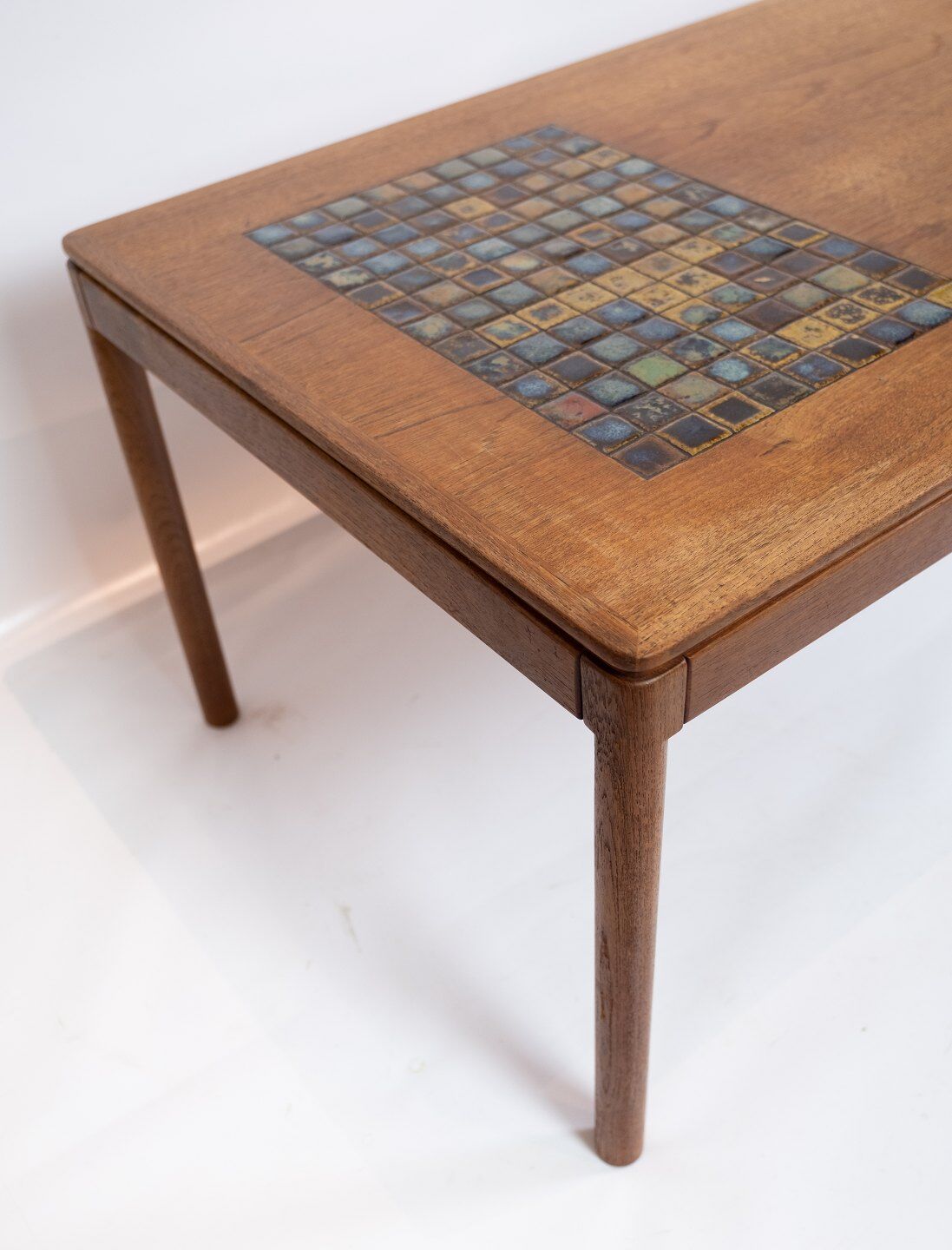 Coffee table in teak with brown ceramic tiles of danish design from the 1960s.