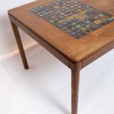 Coffee table in teak with brown ceramic tiles of danish design from the 1960s.