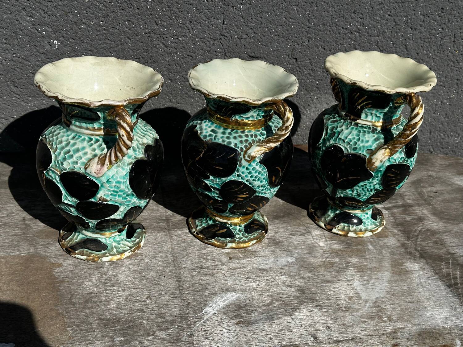 Trio of Vallauris vases in turquoise and black, highlighted with gold, 22 cm high