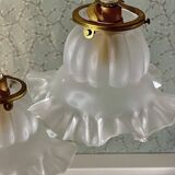 Two vintage tulip pendant lights in molded glass