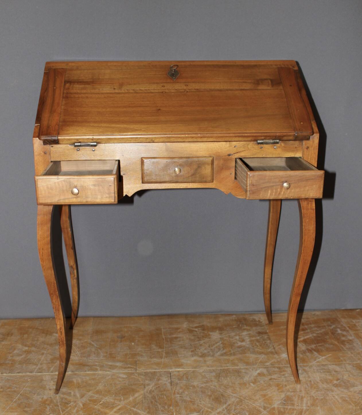 Louis XV donkey back desk in 18th century walnut