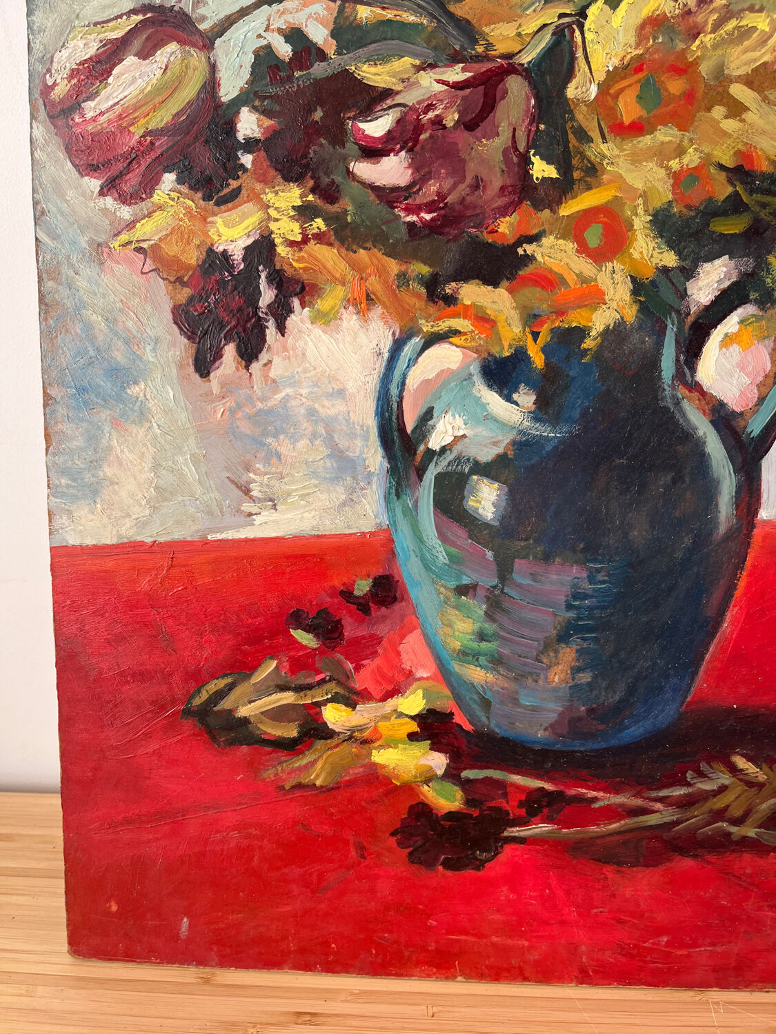 Bouquet of flowers on a red tablecloth, knife on a board, signed Renzo.