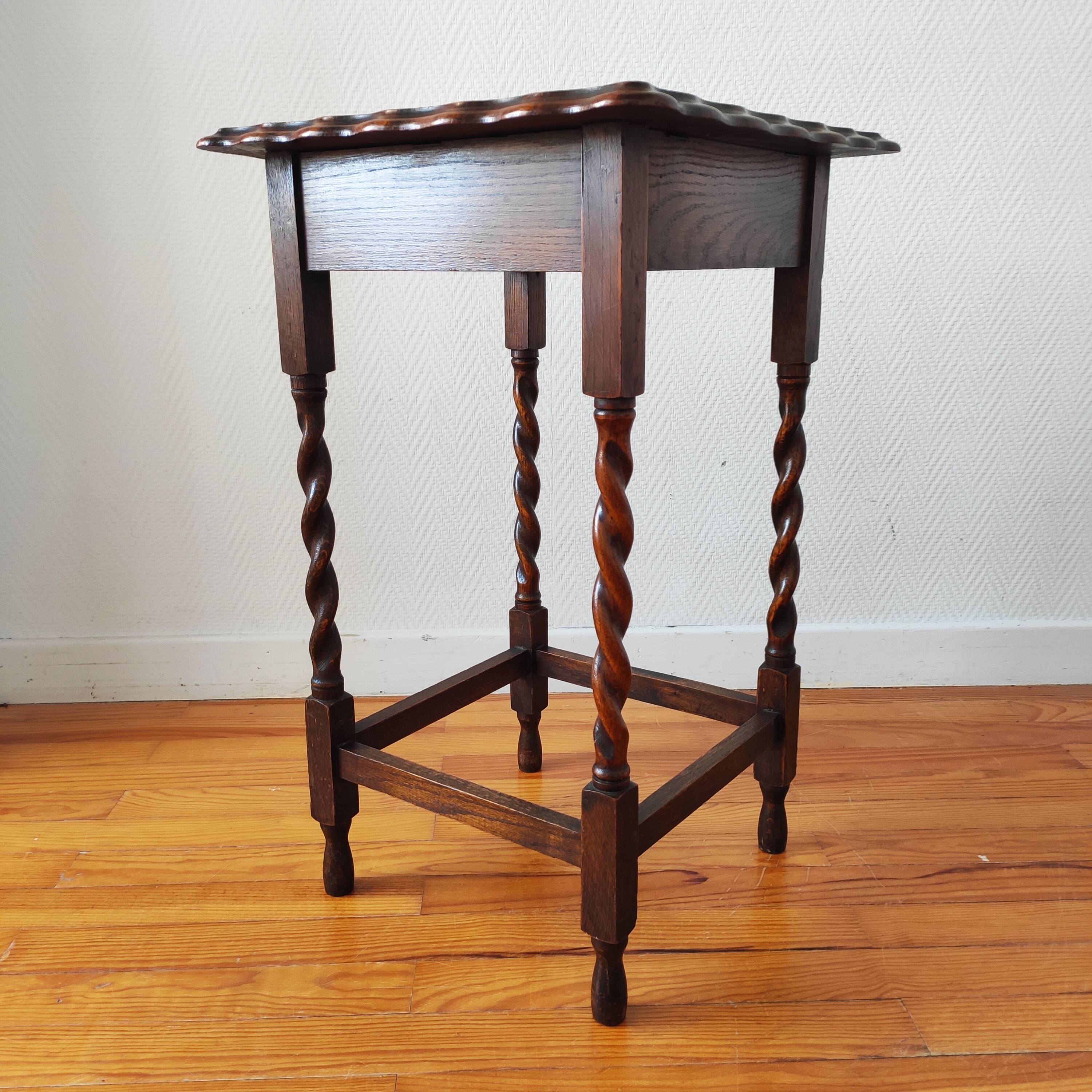 Antique solid oak side table with turned wooden legs.