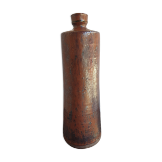 Old bottle in pyrity sandstone
