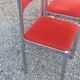 Pair of designer chairs in chrome metal and orange velvet from the 1970s.