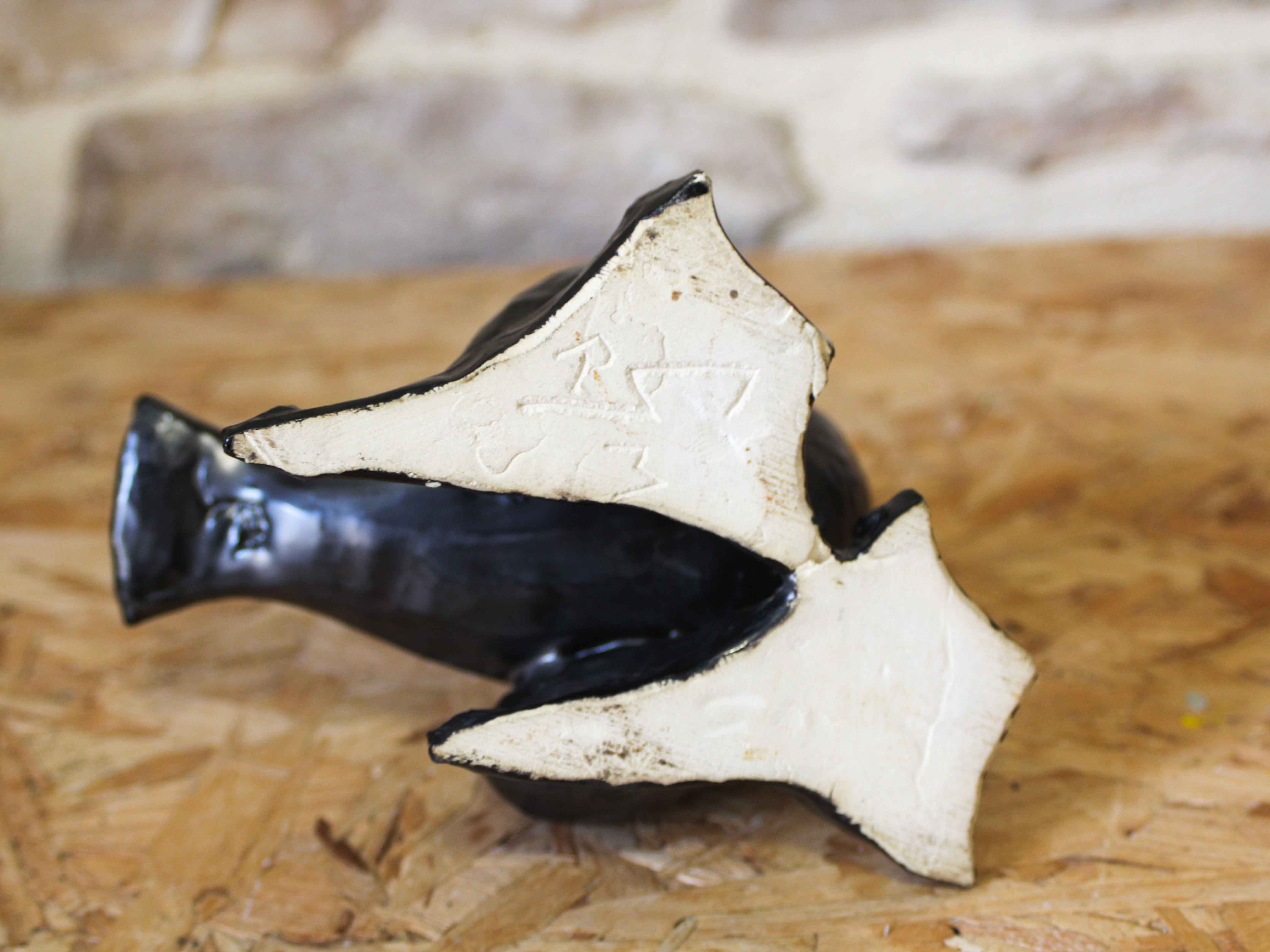 Glazed ceramic ashtray in the shape of a bird.