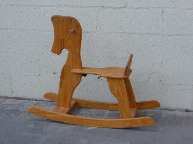 Horse rocking in pine