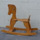 Horse rocking in pine
