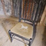 1900s Chair with drawing of an embroidered hunting dog and wooden beads