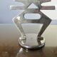 Ethnic “skeleton” candle holder in nickel-plated brass from the 80s