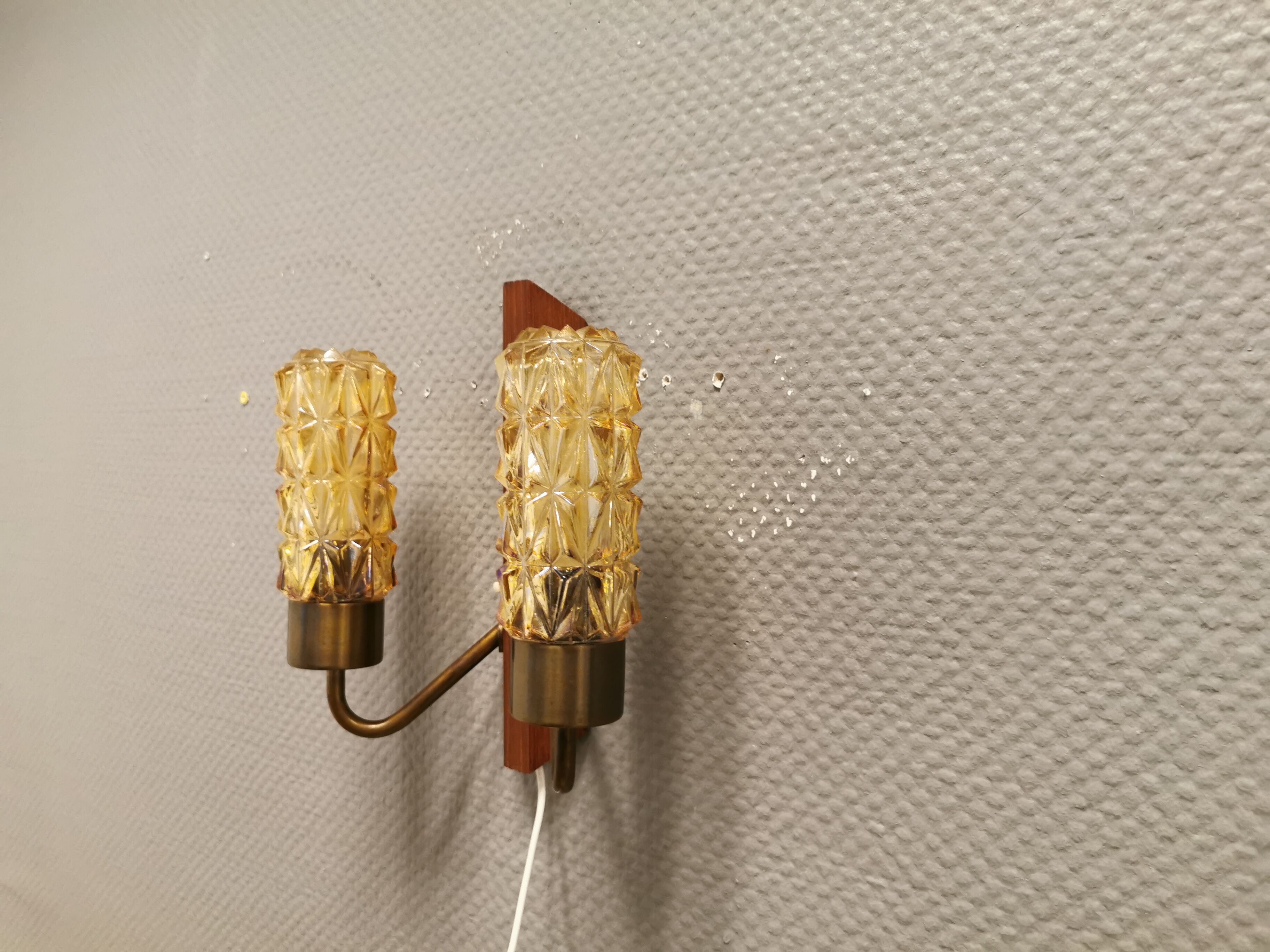 Older Danish wall lamp, with double light source, made of teak wood, amber colored glass and brass