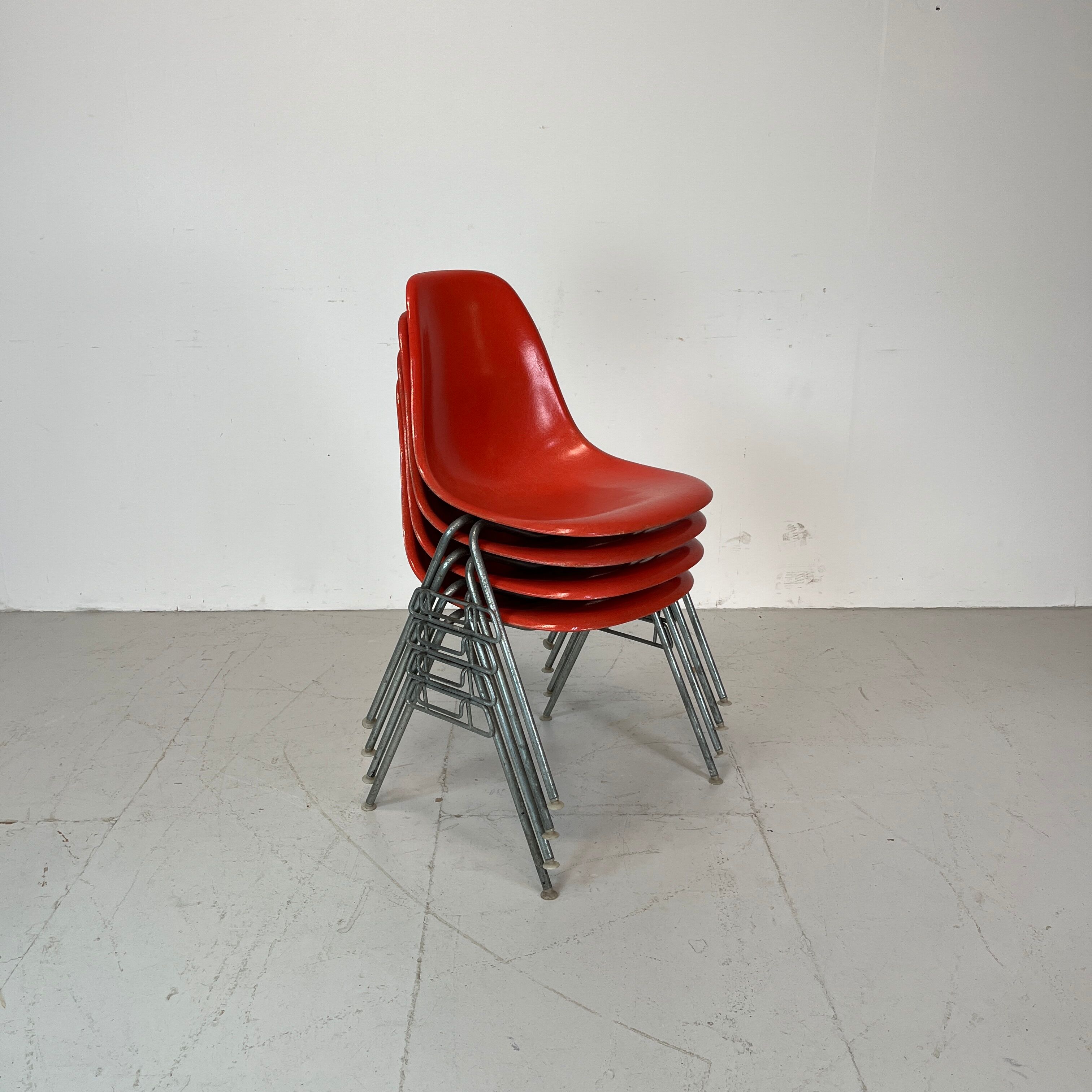 Vintage Eames Herman Miller DSS side chairs in coral orange