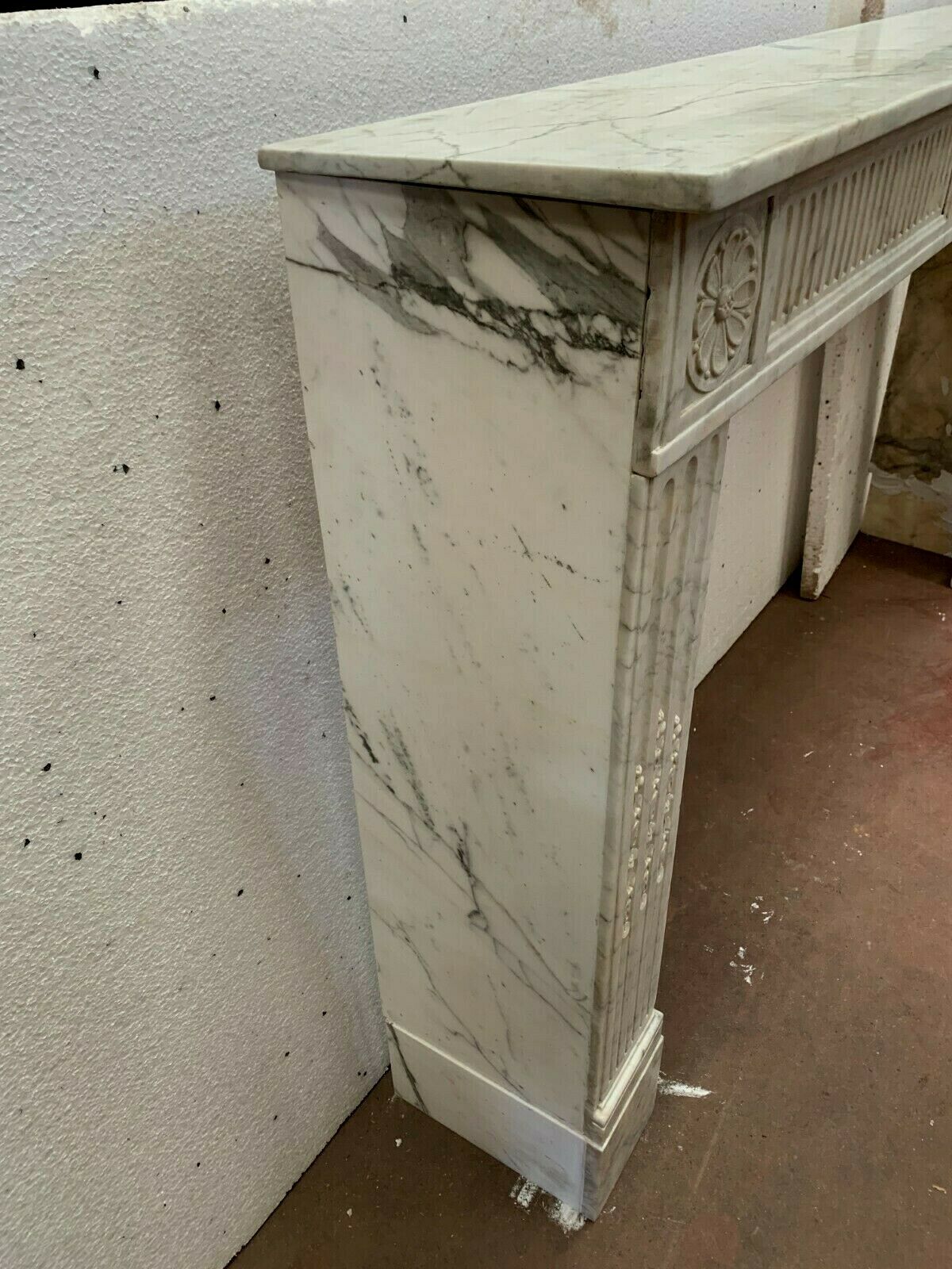 Louis XVI fireplace in 19th century white Carrara marble